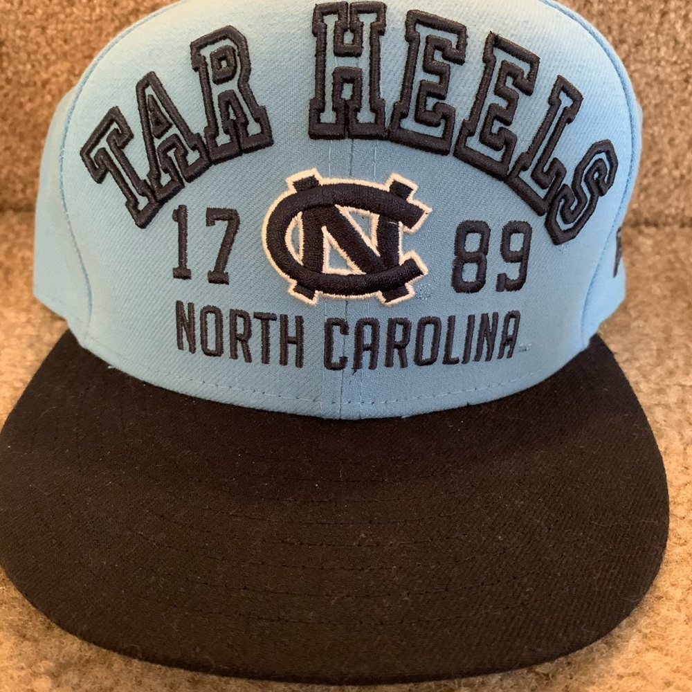 Blue and black North Carolina flat bill hat